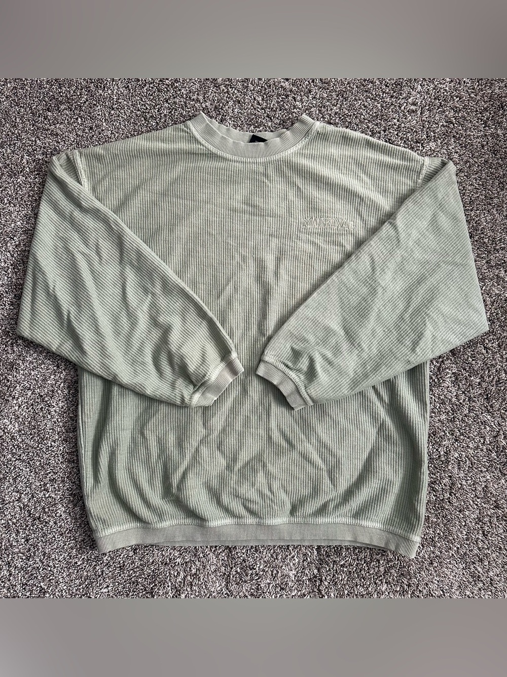 Mackinac Island green crew neck sweater with Mackinac embroidered on left chest